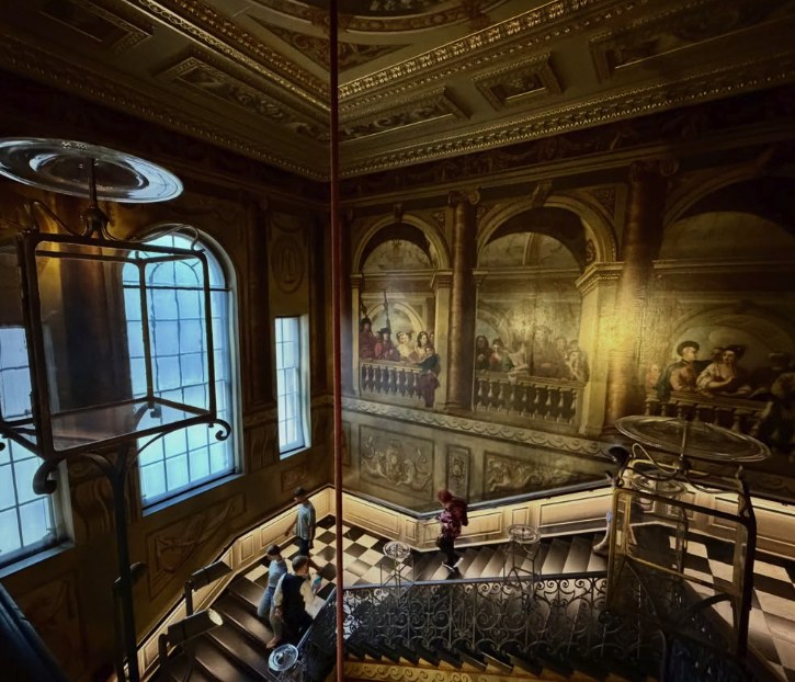 The King's Grand Staircase with
Kent's painted courtiers above the ironwork banister